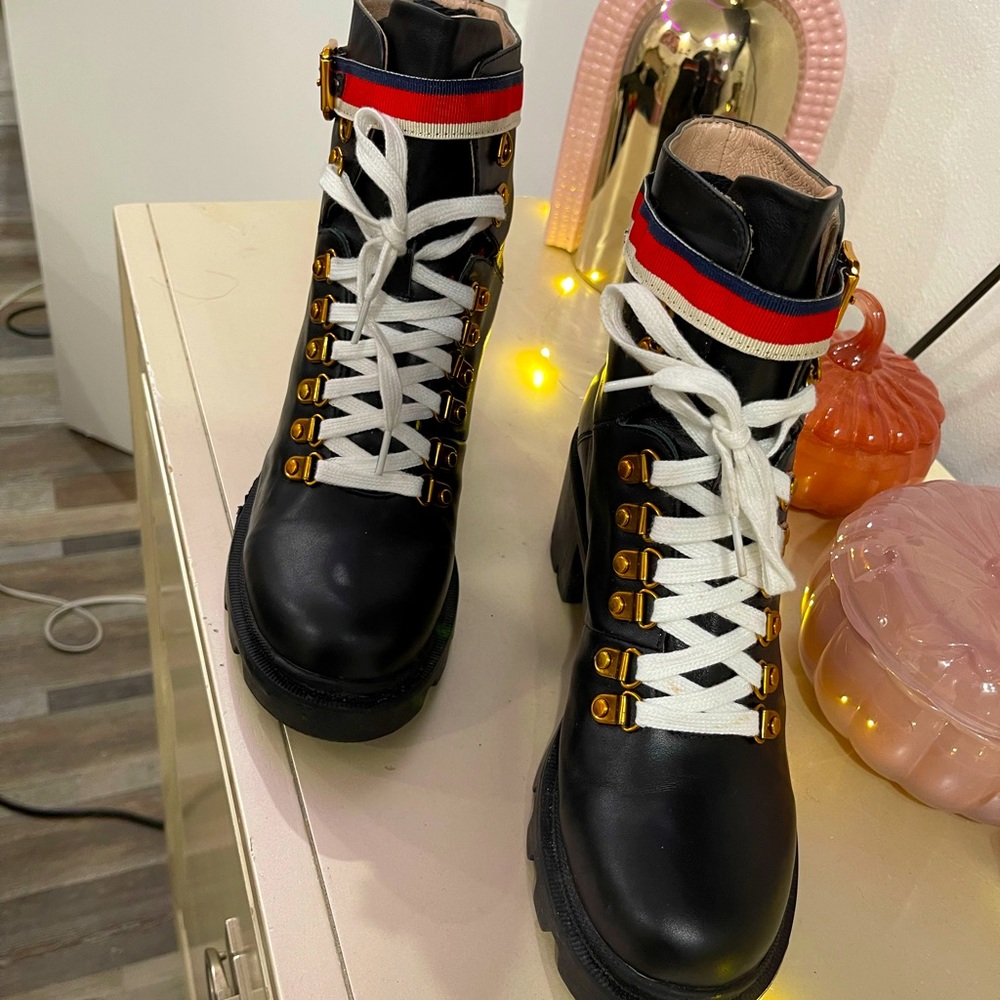 Black booties with red, blue and white stripes